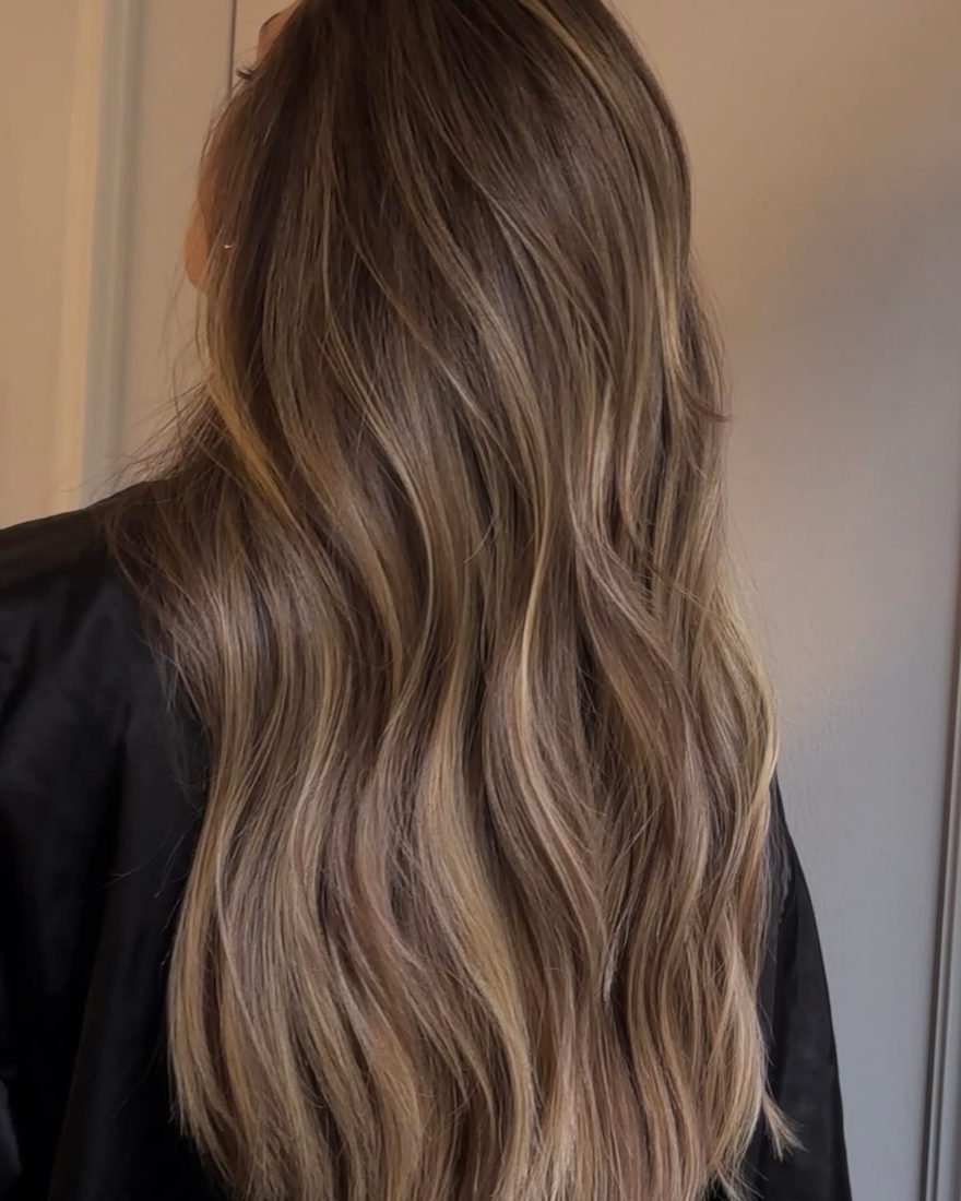 Balayage with soft ribbons of blonde through the lengths