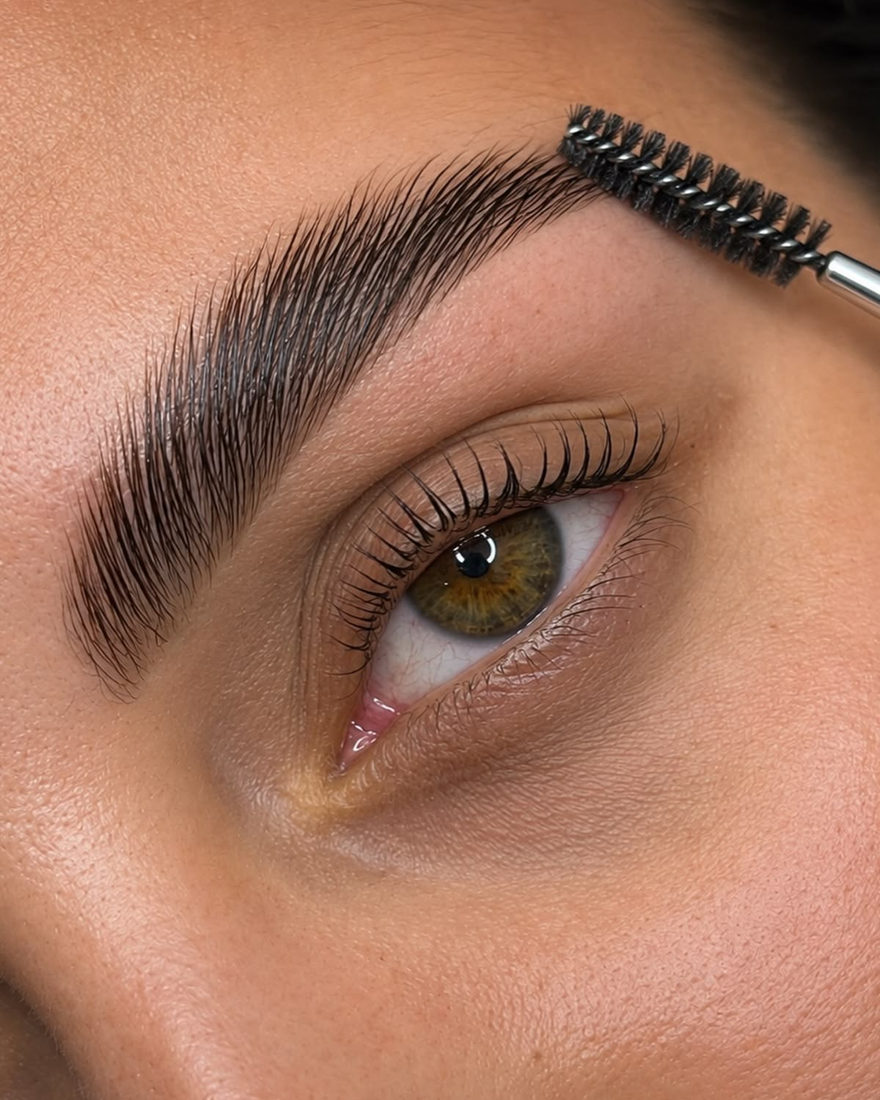 A laminated brow being brushed through at Blanche Beauty